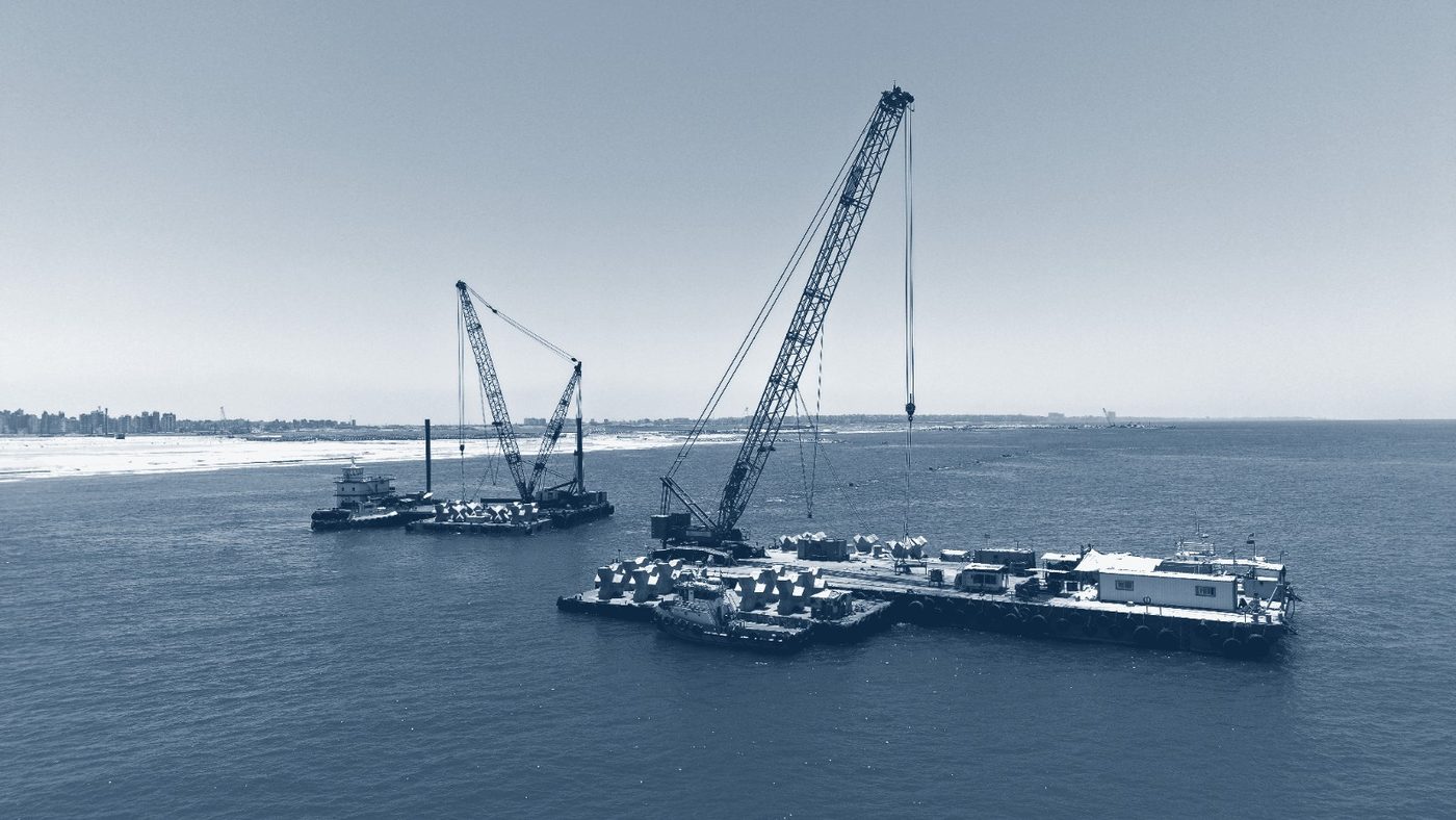Crane barges placing armour units at sea